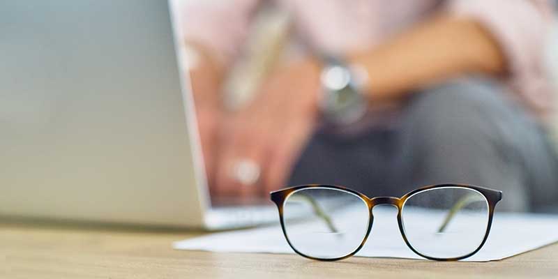 Glasses on-top of desk